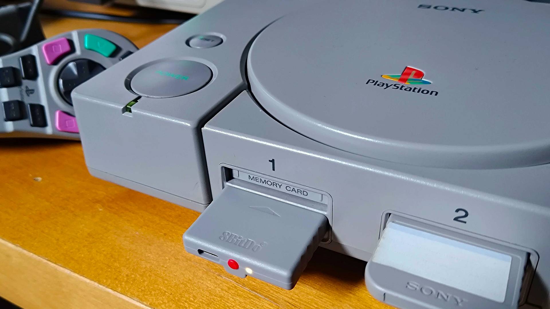 Close up of PS1 8Bitdo Retro Receiver in controller port.