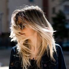 Best affordable hair straighteners - woman with blonde hair in the wind