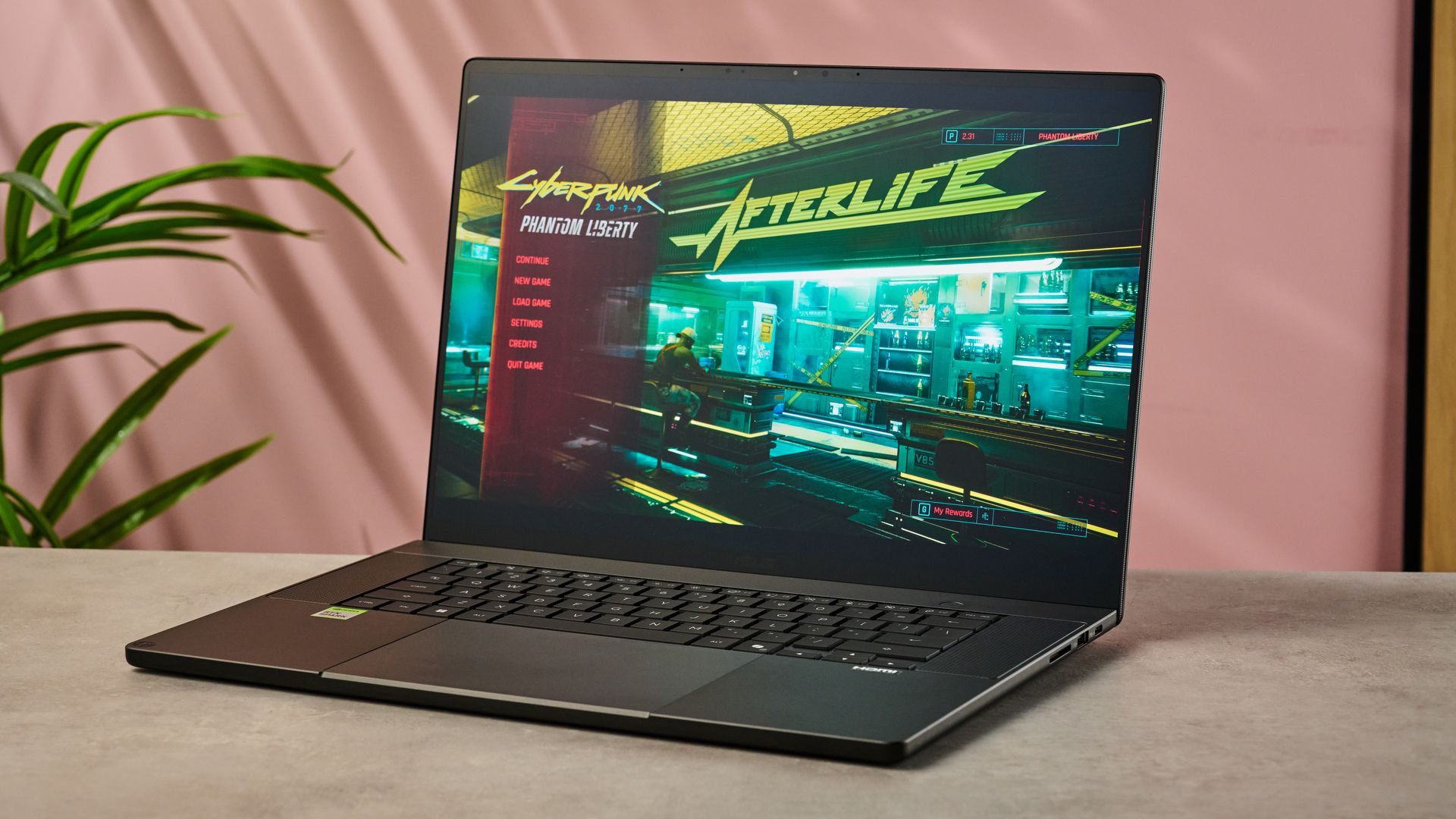 The Asus ProArt P16 RTX Spark showing the Cyberpunk 2077 menu on its display.