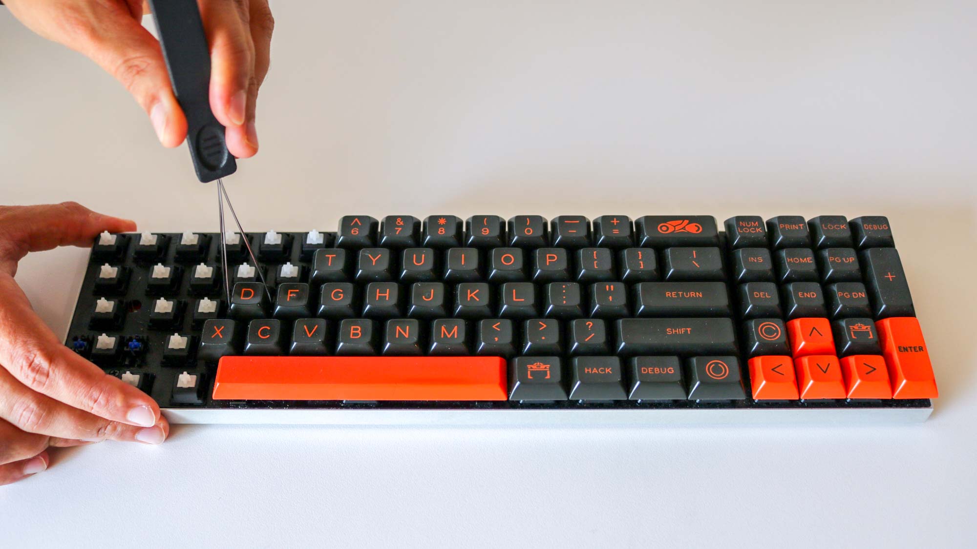 Using a keycap puller to remove keycaps from a mechanical keyboard