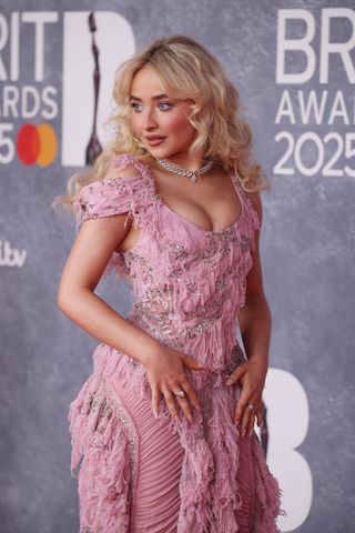 Sabrina Carpenter wears a pink McQueen gown to the BRIT Awards 2025