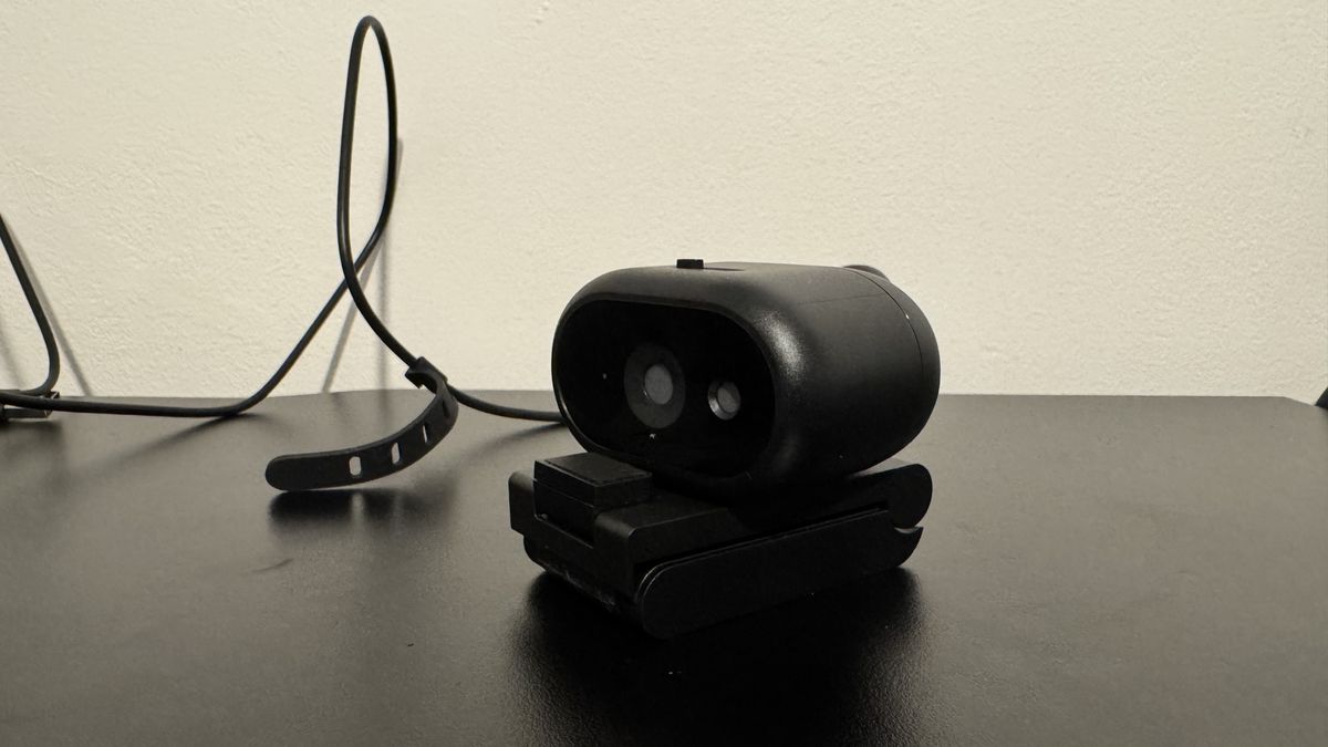 Dell Pro 5 webcam on its stand on top of a black table