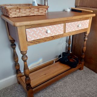 wooden dressing table with basket and shoes