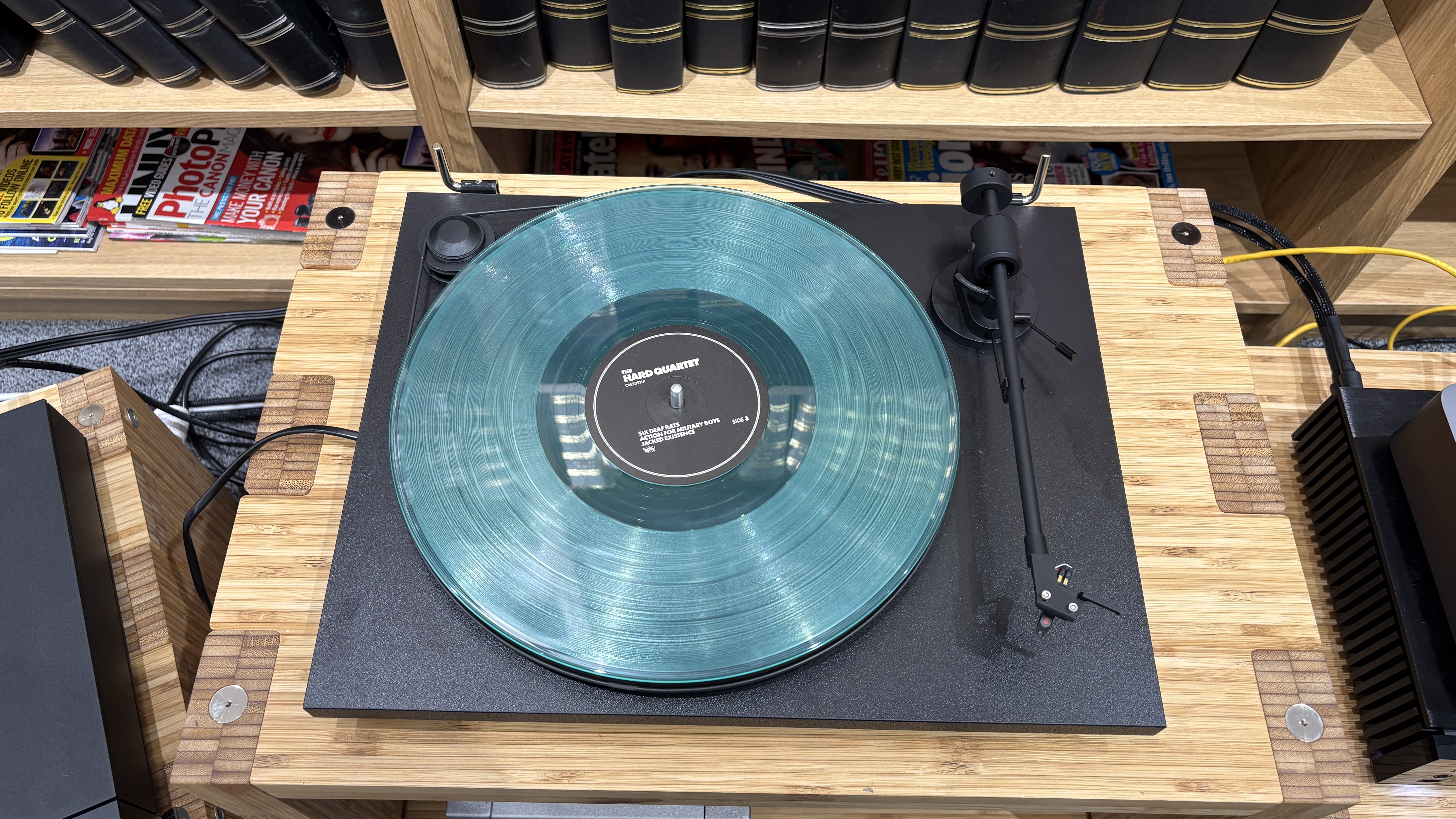 Pro-Ject Primary E turntable on wooden rack