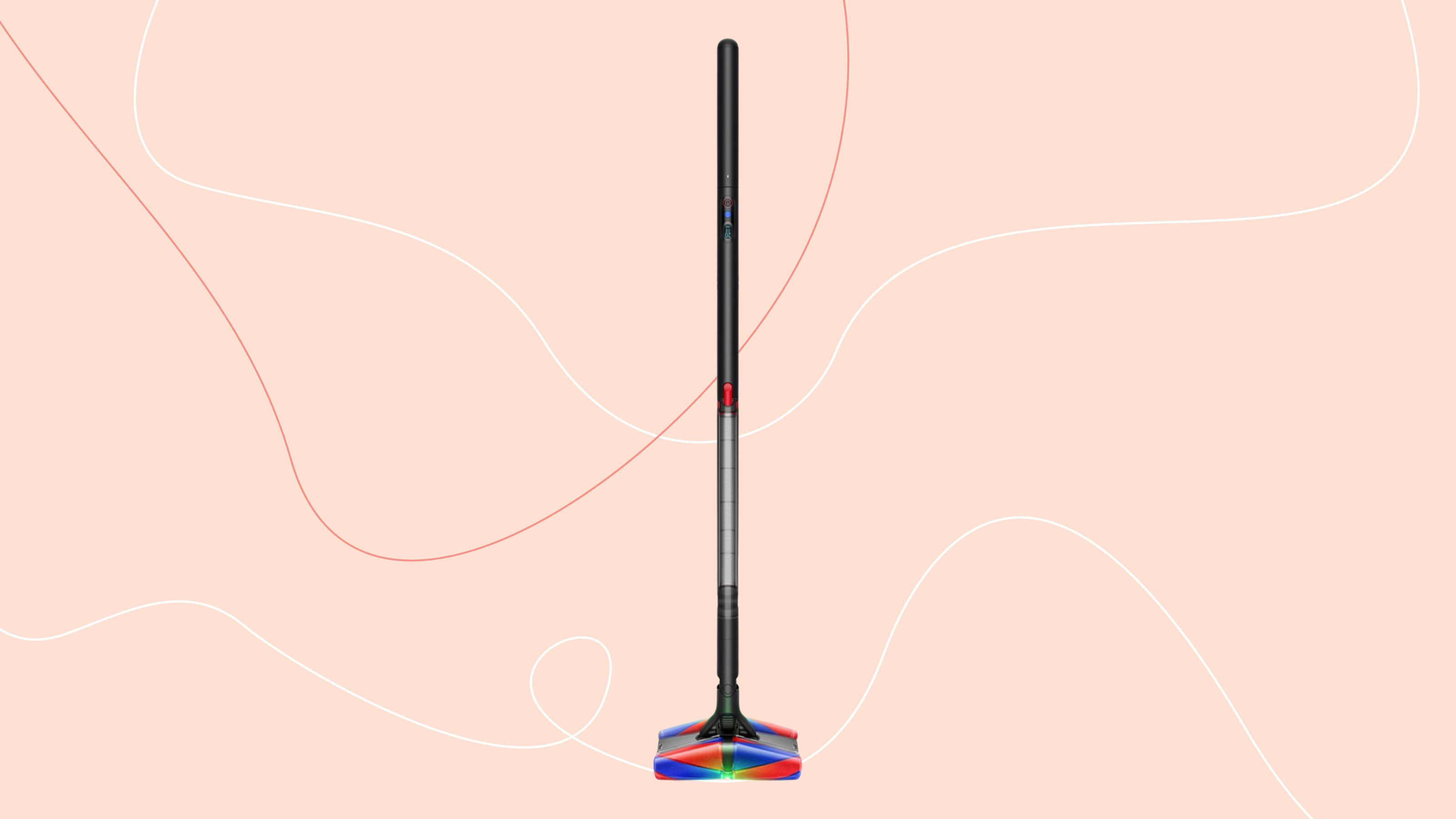 Dyson PencilVac on a pink background
