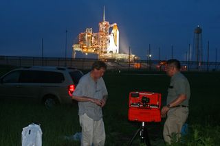 Edwin Aguirre, right, and Brendan McCarthy set up the homemade remote camera near the launch pad on the night of July 7, 2011 on the eve of the final launch of space shuttle Atlantis.