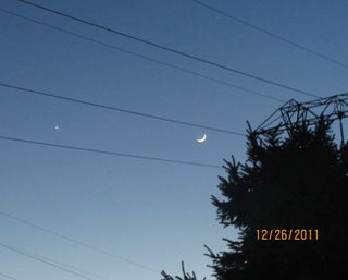 The crescent moon and Venus shine bright on Dec. 26, 2011 as daylight wanes in Chester County, Pa., in this photo snapped by skywatcher Pat Curry.