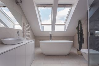 a loft conversion bathroom featuring a compact bath tub from bc designs