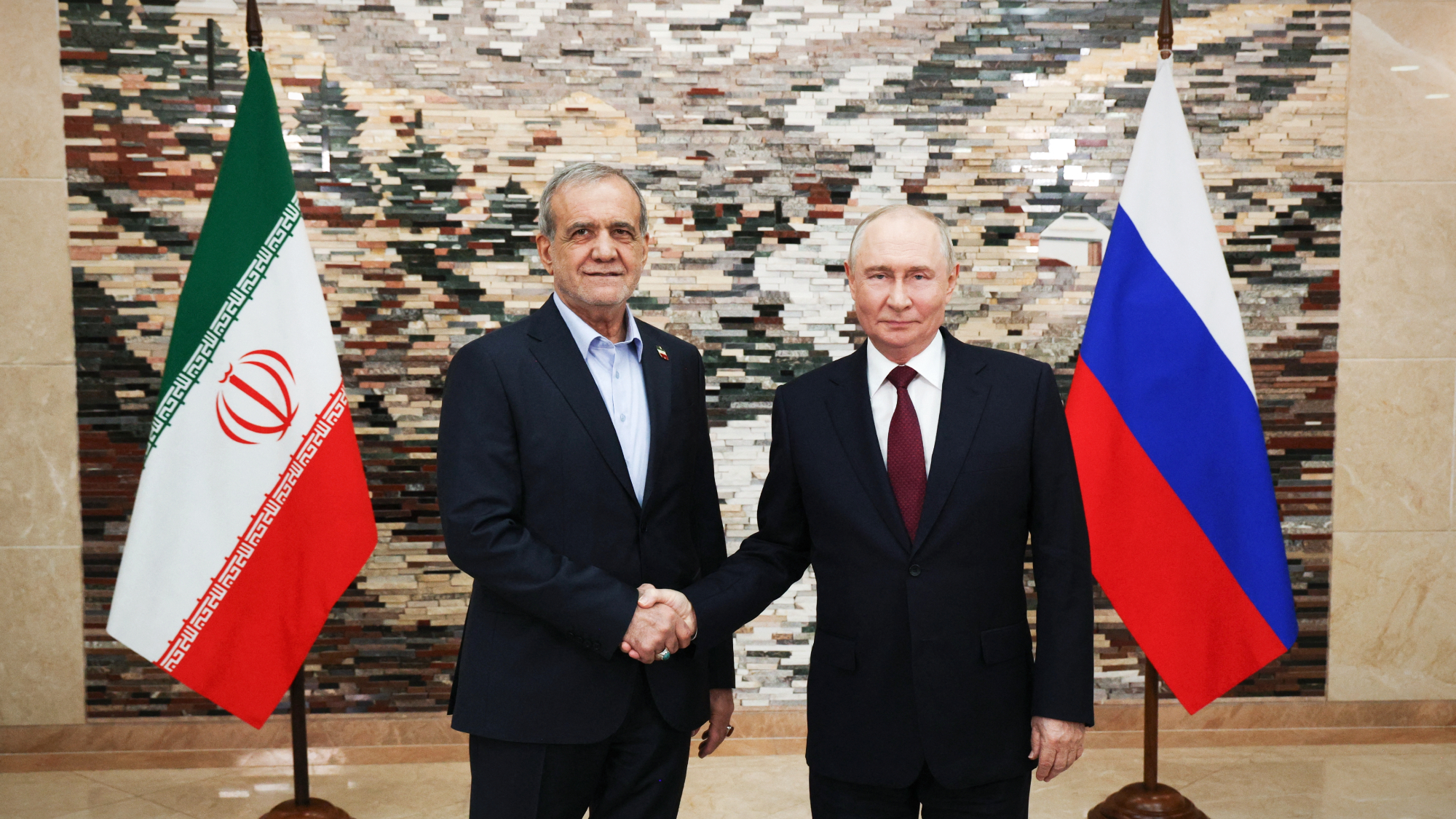 Russian President Vladimir Putin (R) meets with Iranian President Masoud Pezeshkian (L) on the sidelines of the Shanghai Cooperation Organization summit in Bishkek, Kyrgyzstan.