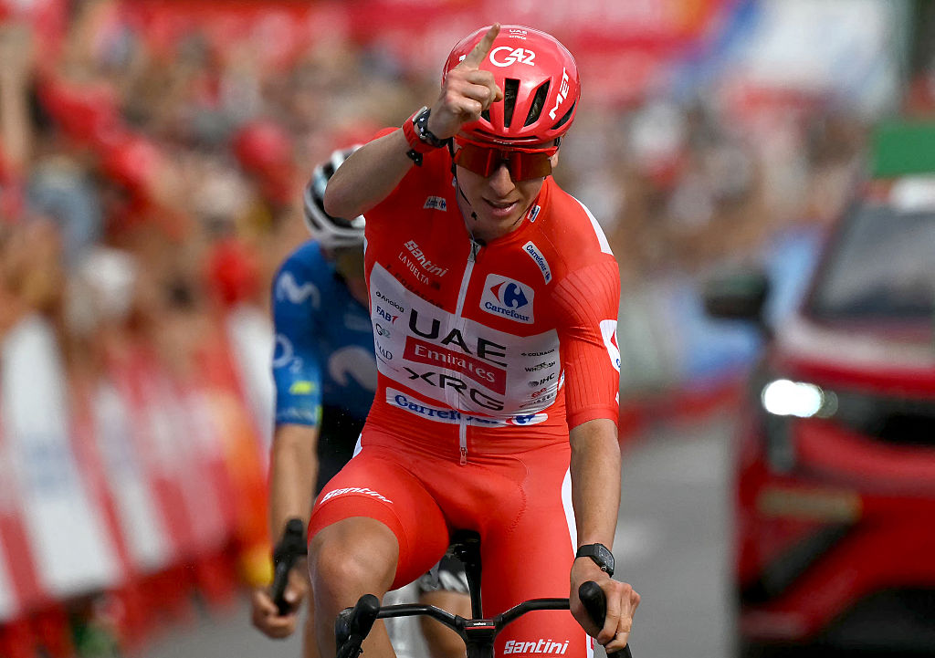 Team UAE's Slovenian rider Tadej Pogacar celebrates as he crosses first the finish line of the sixth stage of the Vuelta a Espana 2026, a 177,4 km race between Alcossebre and Castellon de la Plana on August 27, 2026. (Photo by JOSE JORDAN / AFP)