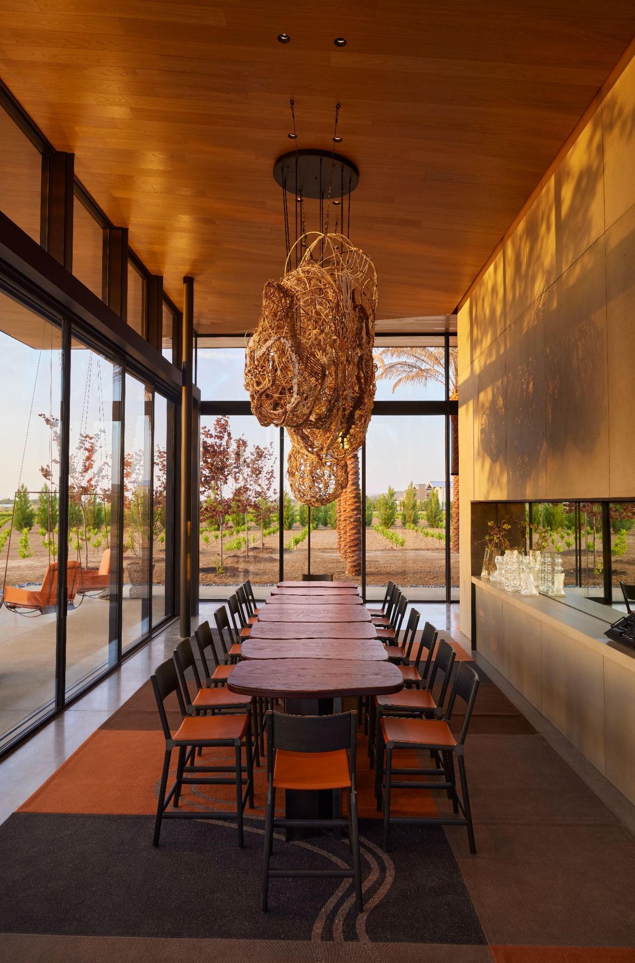 A sun-lit winery features wooden modern decor.