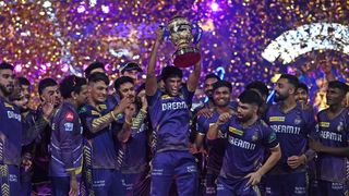 The victorious Kolkata Knight Riders players celebrate with the trophy after winning the 2024 Indian Premier League