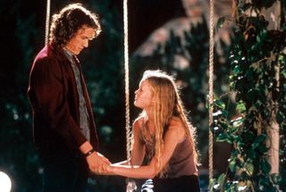 Heath Ledger and Julia Stiles hold hands in the movie 10 Things I Hate About You