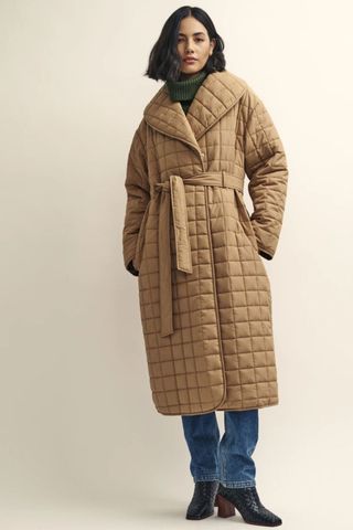 iceland fashion woman wearing beige quilted long coat