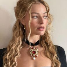 Margot Robbie with blonde wavy hair, styled by Bryce Scarlett