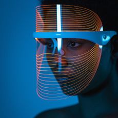Woman wearing an LED face mask
