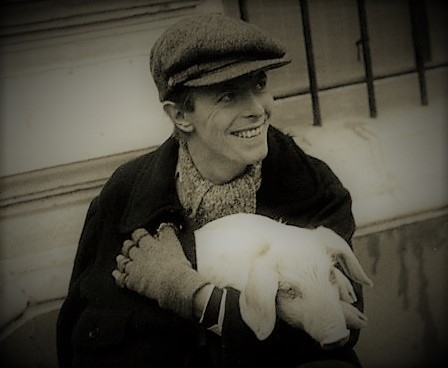 David Bowie holding a pig