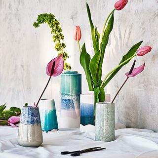 Florbella Ceramic Vases with flowers standing on a white cloth