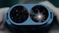 Composite of the Veil Nebula and stars inside the lenses of the Fujifilm Techno-Stabi 1640 binoculars with hands holding the body.