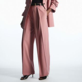 model wearing dusty pink Cos Wide Leg Trousers