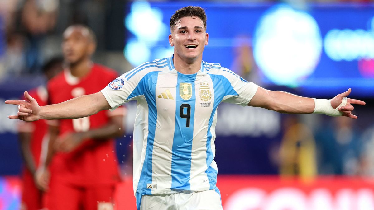 Julian Alvarez celebrates a goal in, Argentina&#039;s blue and white striped shirt, ahead of the 2024 Paris Olympic Games soccer competition.