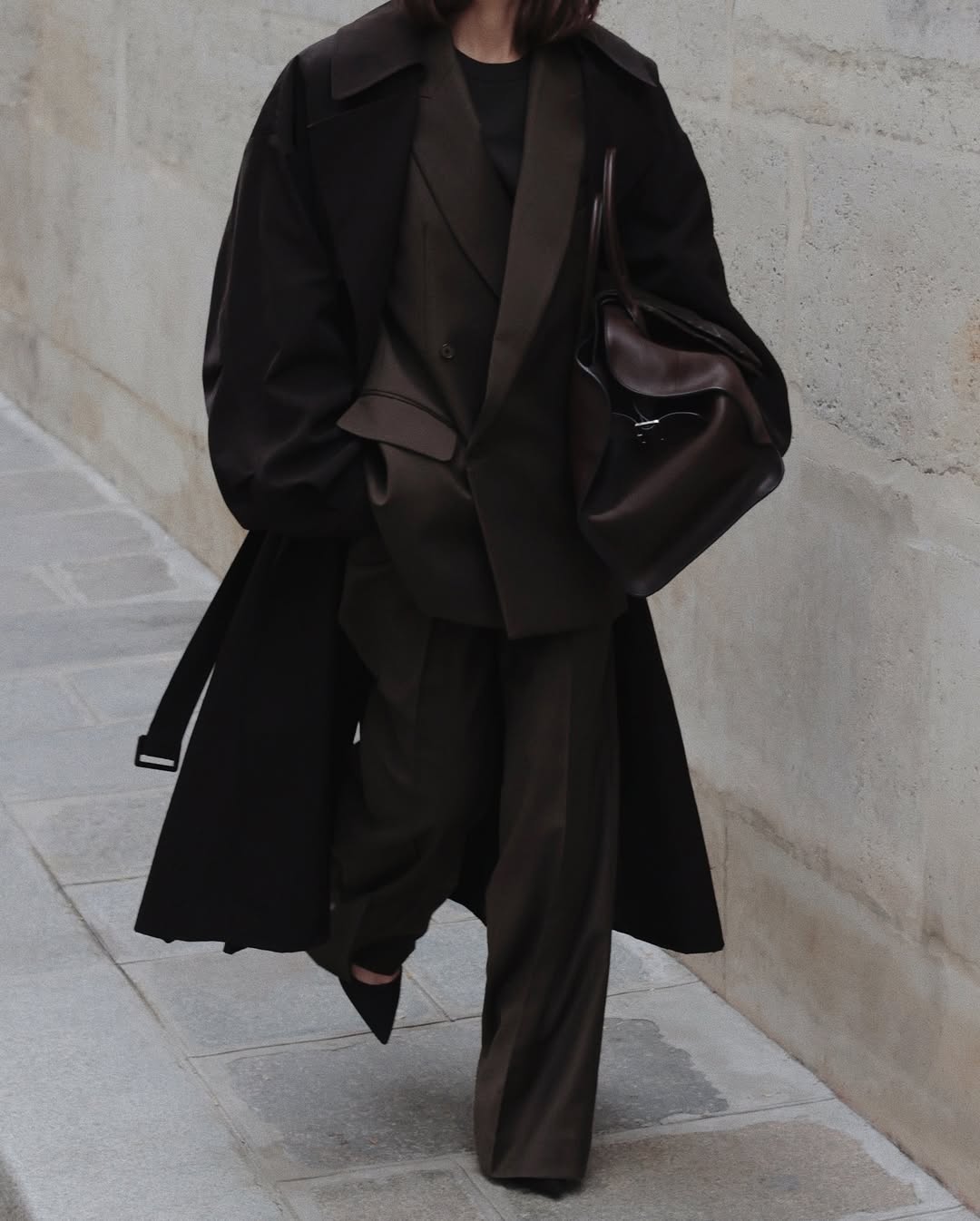 @modedamour wearing brown suit and coat