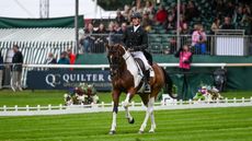 Declan Cullen canters down the centre line at Defender Burghley Horse Trials on Seavaghan Ash.