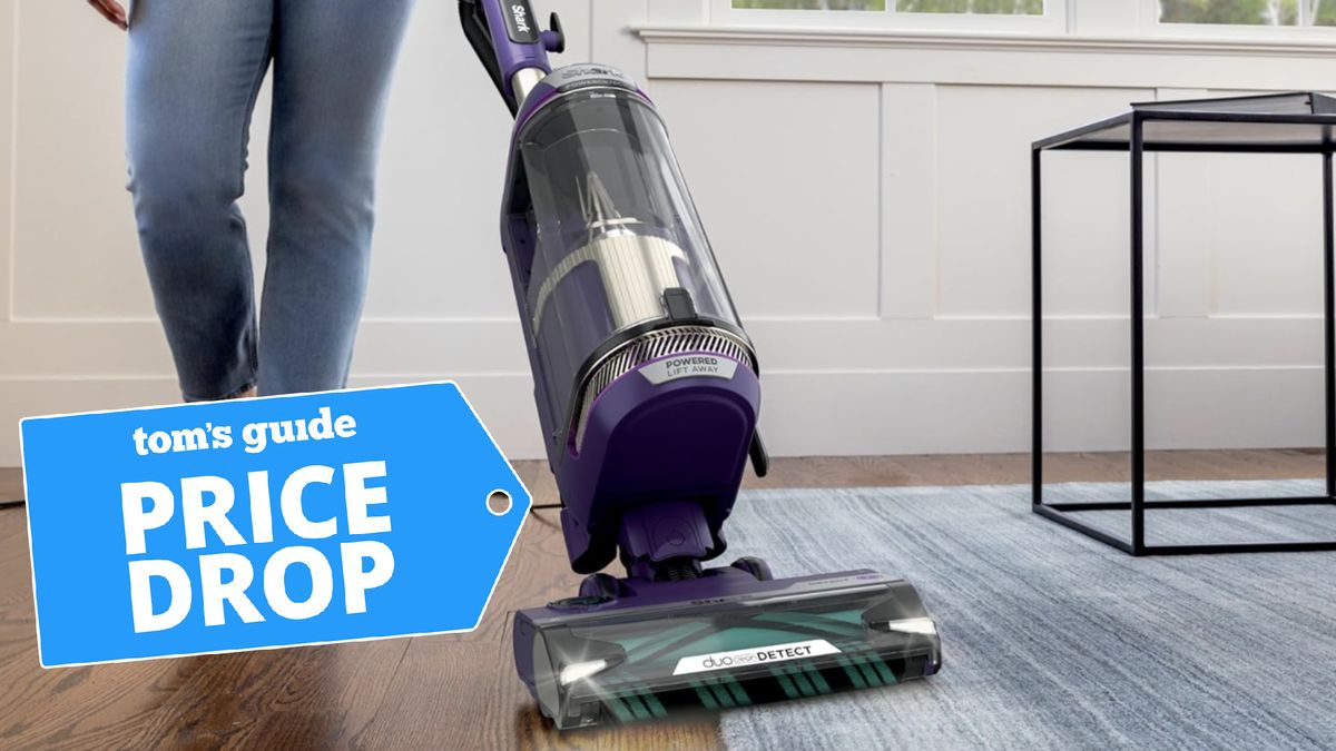 Woman using Shark vacuum