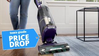 Woman using Shark vacuum