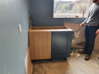 fitting the first units of a new kitchen