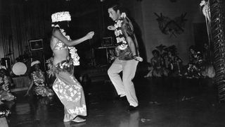 circa 1974: Charles, Prince of Wales dancing with a woman at a social function held in his honour during a Royal tour of Fiji.