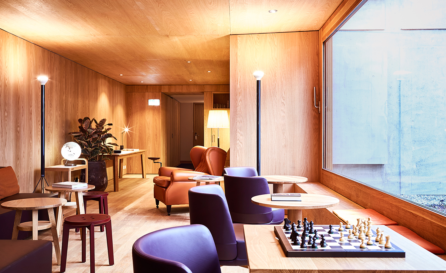 A hotel table and chair with a chess board