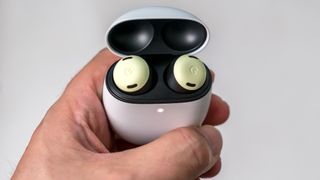 Holding the Google Pixel Buds Pro in their case