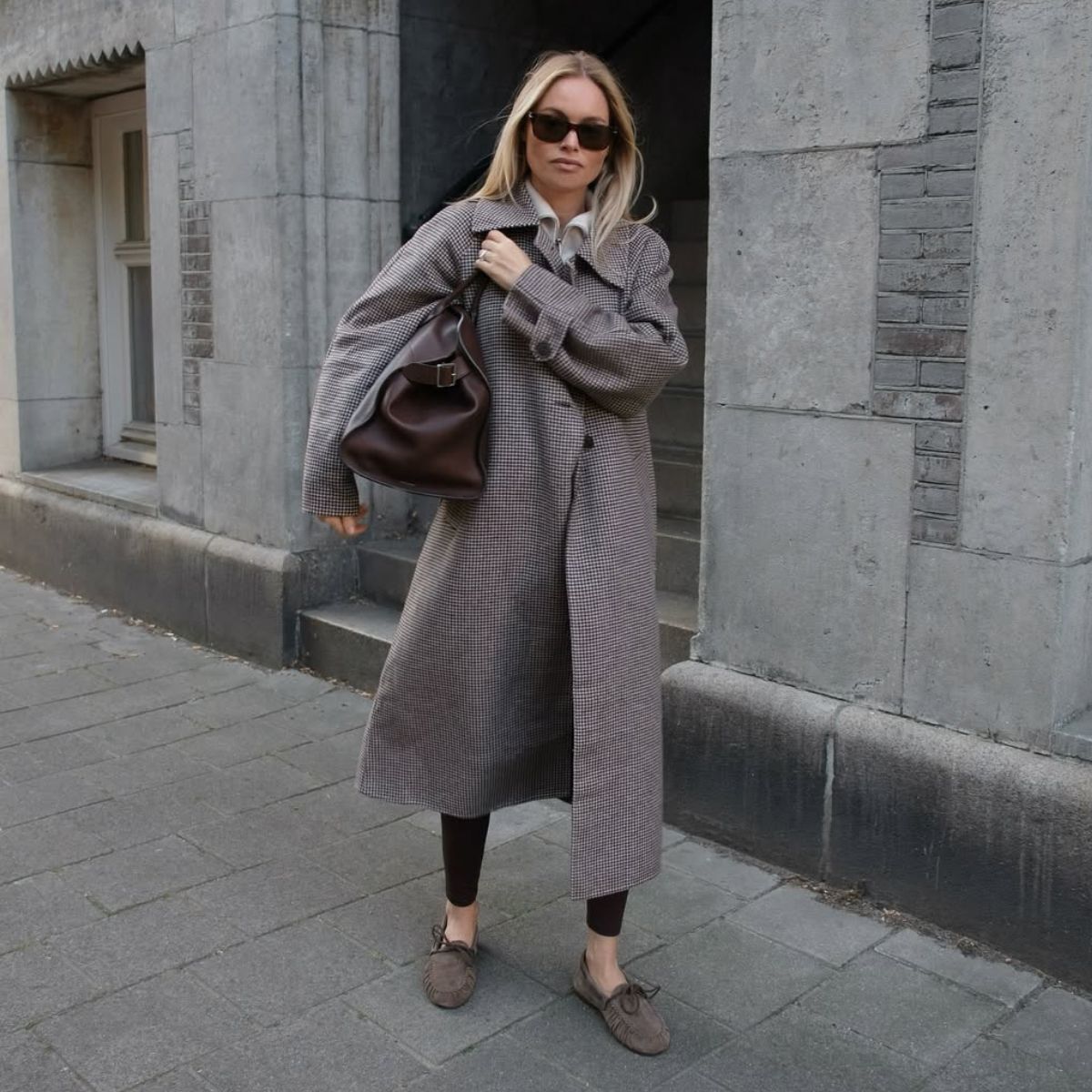 claire rose cliteur wears a coat, leggings and boat shoes