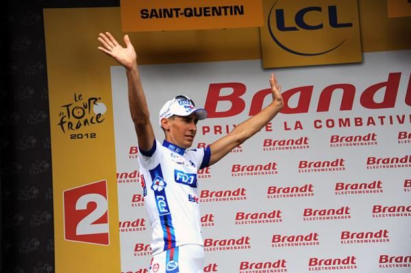 Matthieu Ladagnous (FDJ-Big Mat) steps onto the stage to receive the most combative rider prize for stage 5.