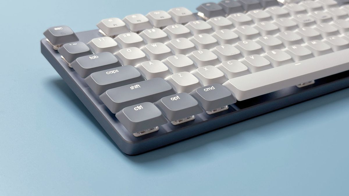 The Satechi SM3 mechanical keyboard against a blue background.