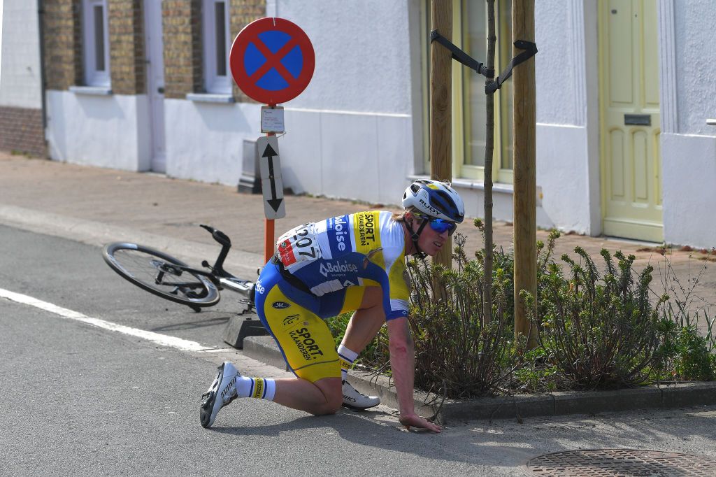 DE PANNE BELGIUM MARCH 24 Sasha Weemaes of Belgium and Team Sport Vlaanderen Baloise during the 45th Oxyclean Brugge De Panne 2021 Men Classic a 2039km race from Brugge to De Panne Crash OxycleanClassic on March 24 2021 in De Panne Belgium Photo by Luc ClaessenGetty Images