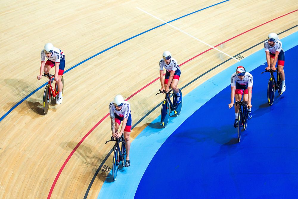 Members of the men's team emerge onto the track