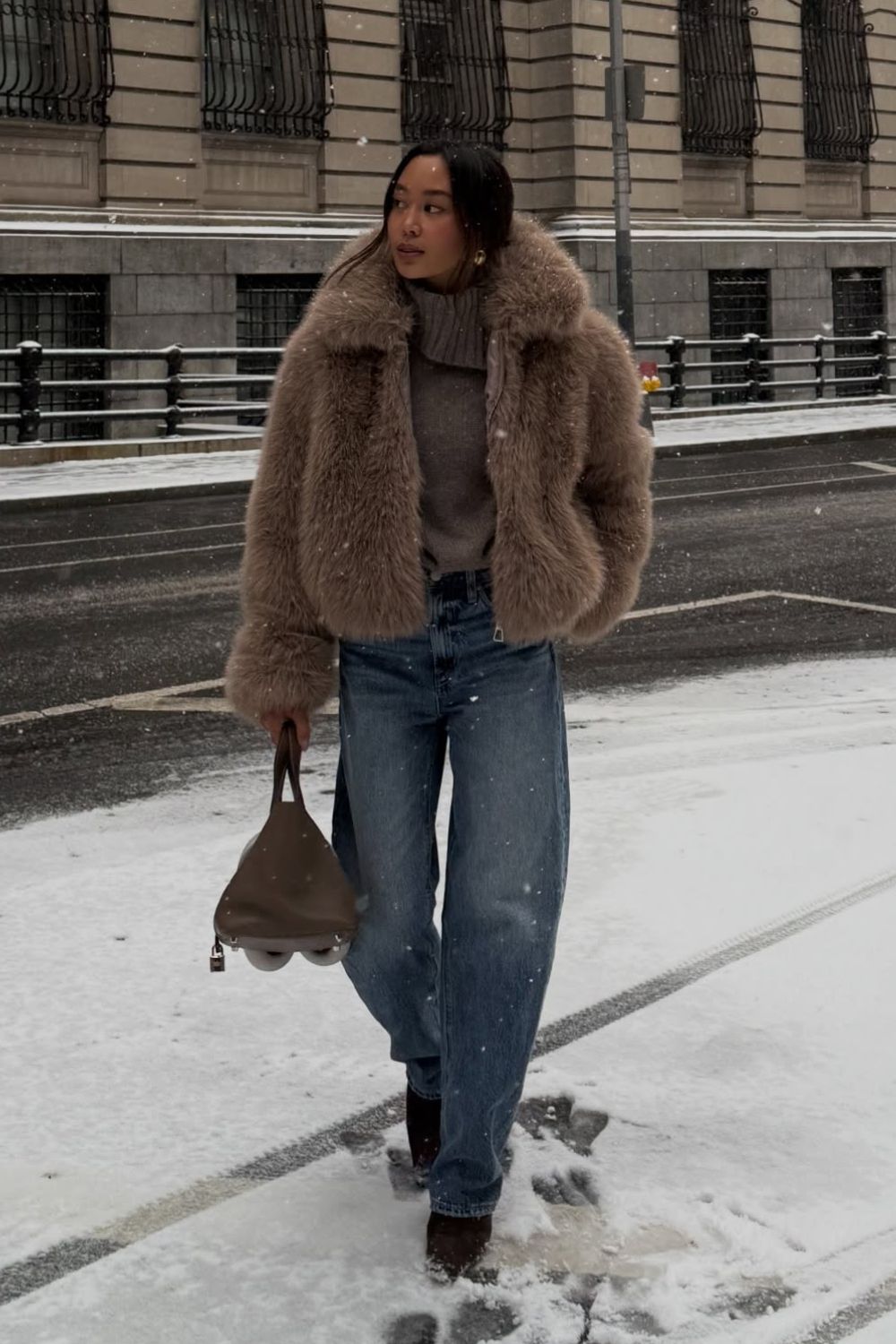 @linhniller wearing a pair of snow boots