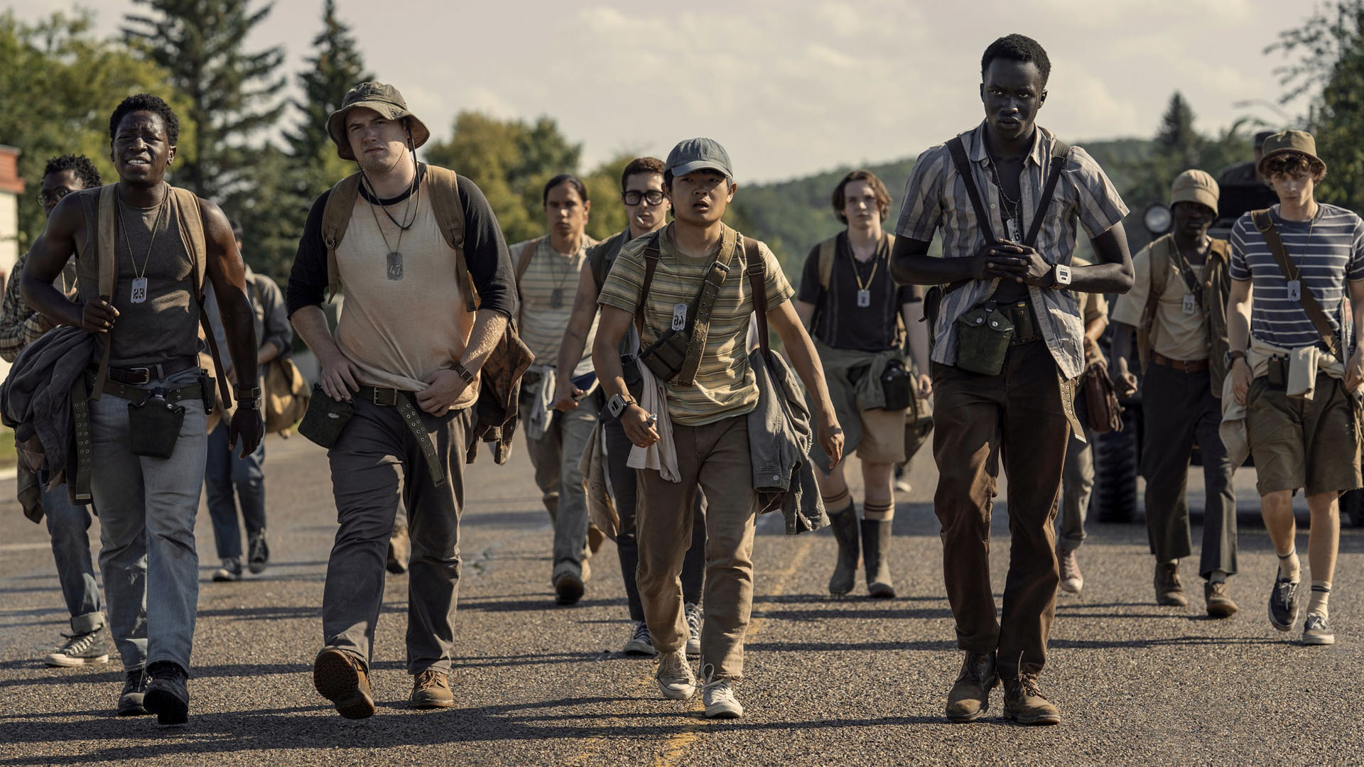A screengrab from The Long Walk showing a crowd of teens walking.