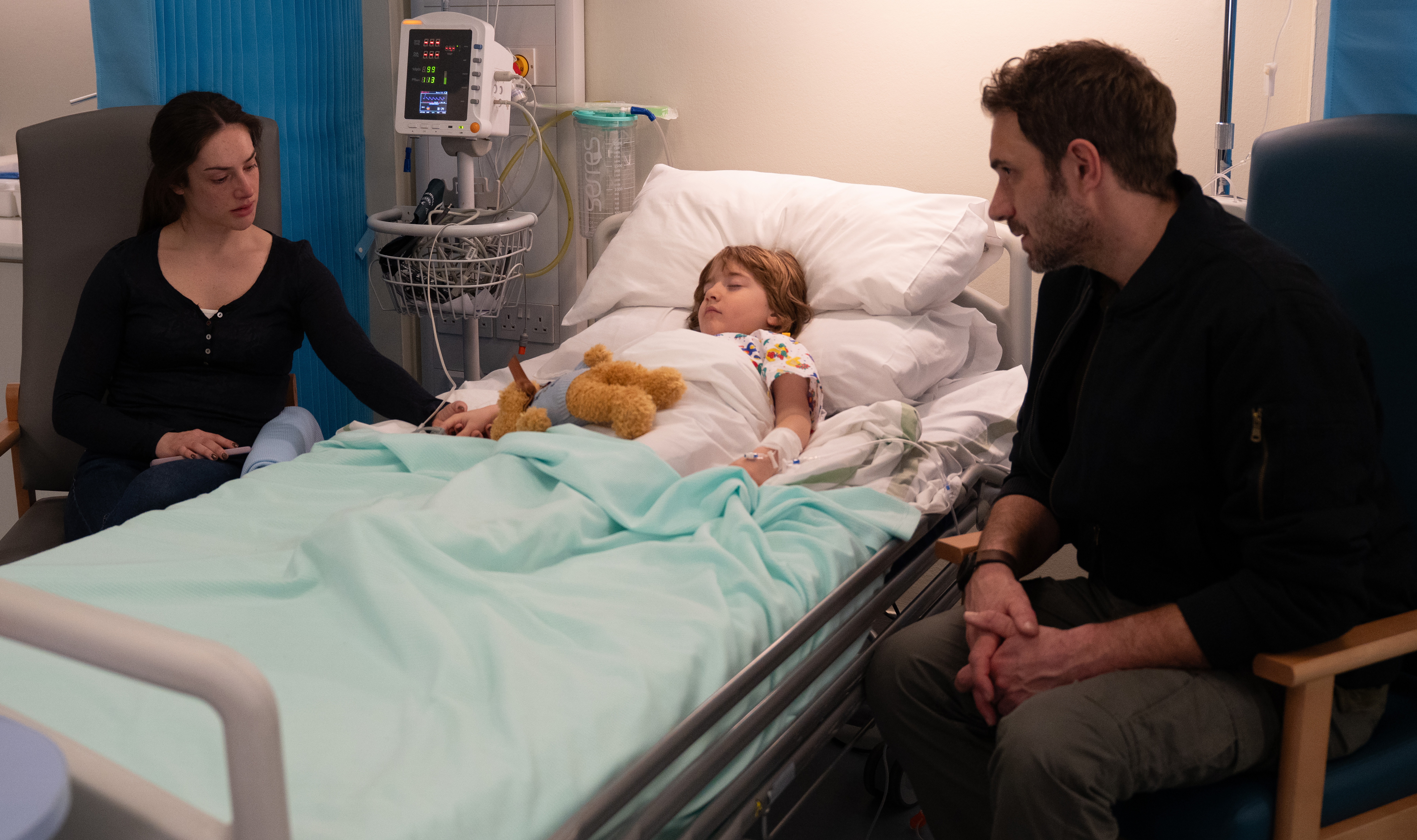 Victoria and John with Harry in hospital