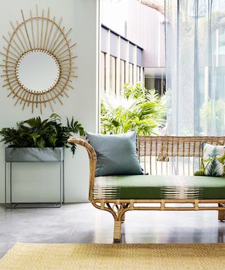 A tropical green living room picture with rattan furniture.