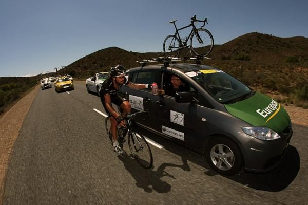 Dan Craven (Rapha Condor-Sharp) goes back for some cold drinks.