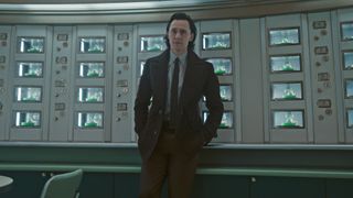 Loki leans against a desk in the TVA in Loki season 2