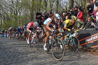 Mathieu van der Poel climbs the Kemmelberg behind Oliver Naesen and Danny van Poppel during the 2019 Gent-Wevelgem