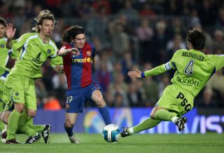 Barcelona forward Lionel Messi in full flow as he goes past Alexis and David Belenguer en route to his famous goal against Getafe at Camp Nou in 2007.