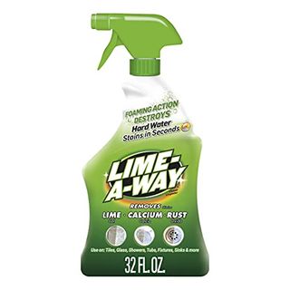 A side on view of a white and green bottle of Lime-A-Way Bathroom Cleaner with green spray lid