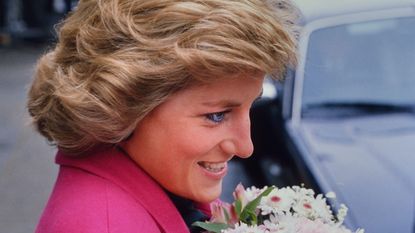 A smiling Diana, Princess of Wales receiving a bouquet of flowers during a visit to the Relate Marriage Guidance Centre in Barnet, north London, 29th November 1988