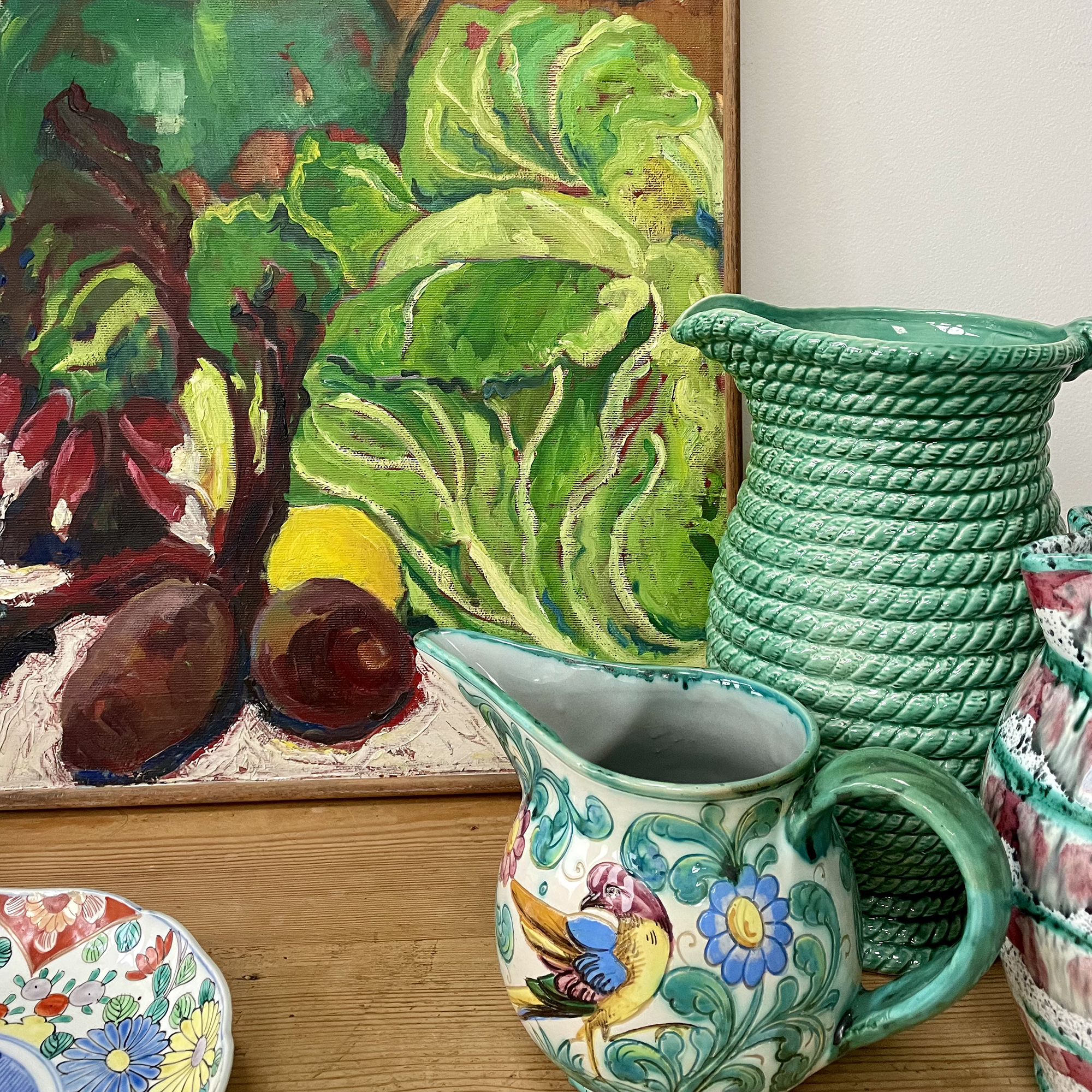 patterned jugs on a wood table