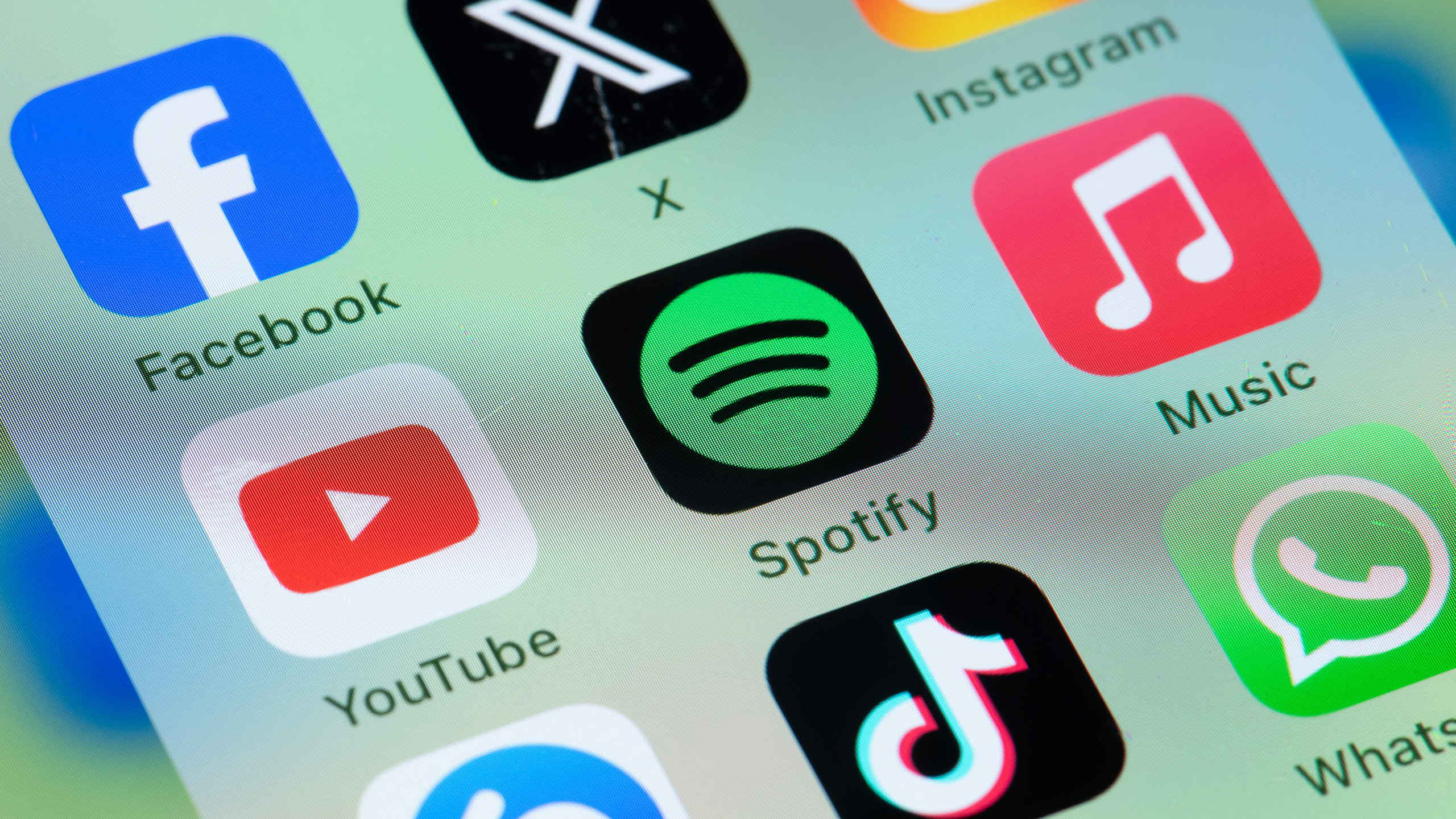 Music and social media apps including formerly twitter x on smart phone screen
